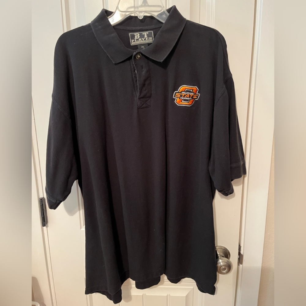 Classic and stylish BT Player black Oklahoma State University polo.